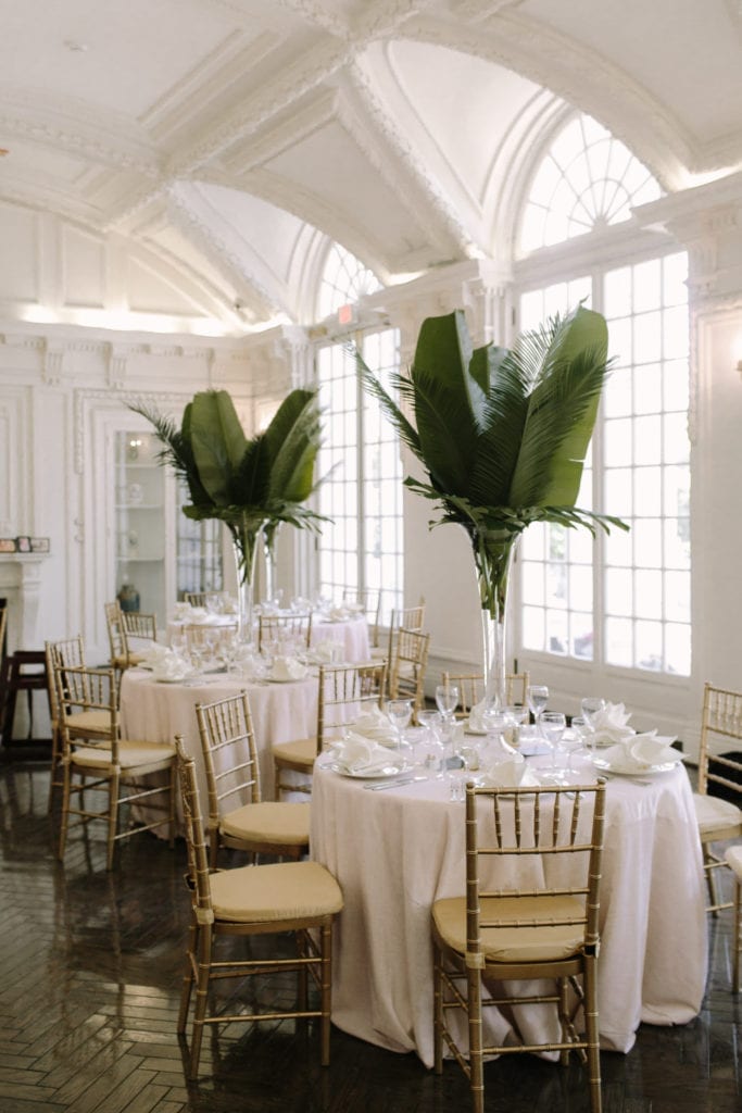 Elevated tall centerpieces with tropical greens