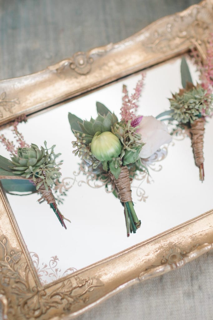 Blush and peach with succulents boutonniere wedding at Stone Manor Country Club