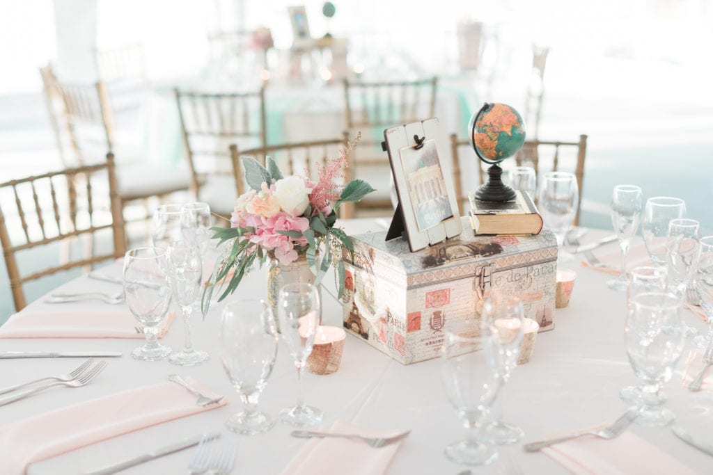 Blush and peach travel themed wedding at Stone Manor Country Club