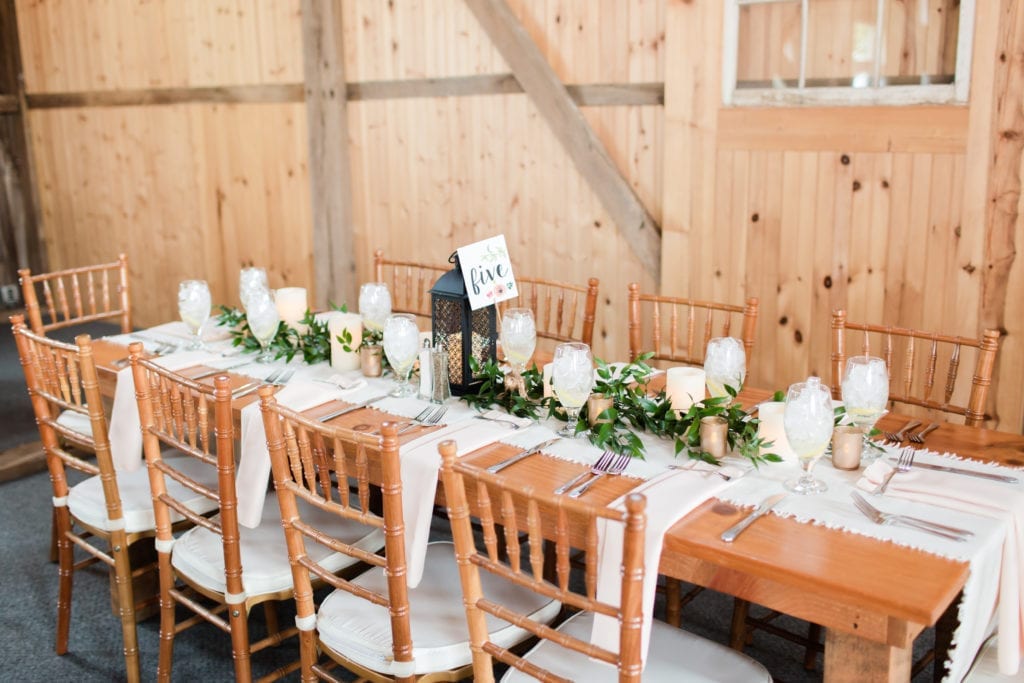 Rustic farm table with garland, lanterns and burlap at Springfield Manor