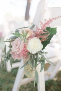 Blush and peach travel themed aisle decor wedding at Stone Manor Country Club