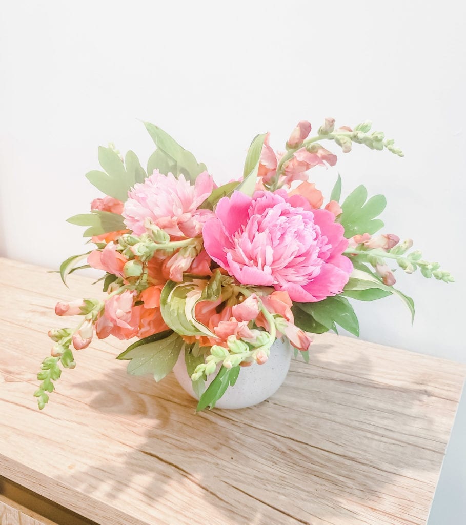 orange and pink floral arrangement with all local maryland grown flowers