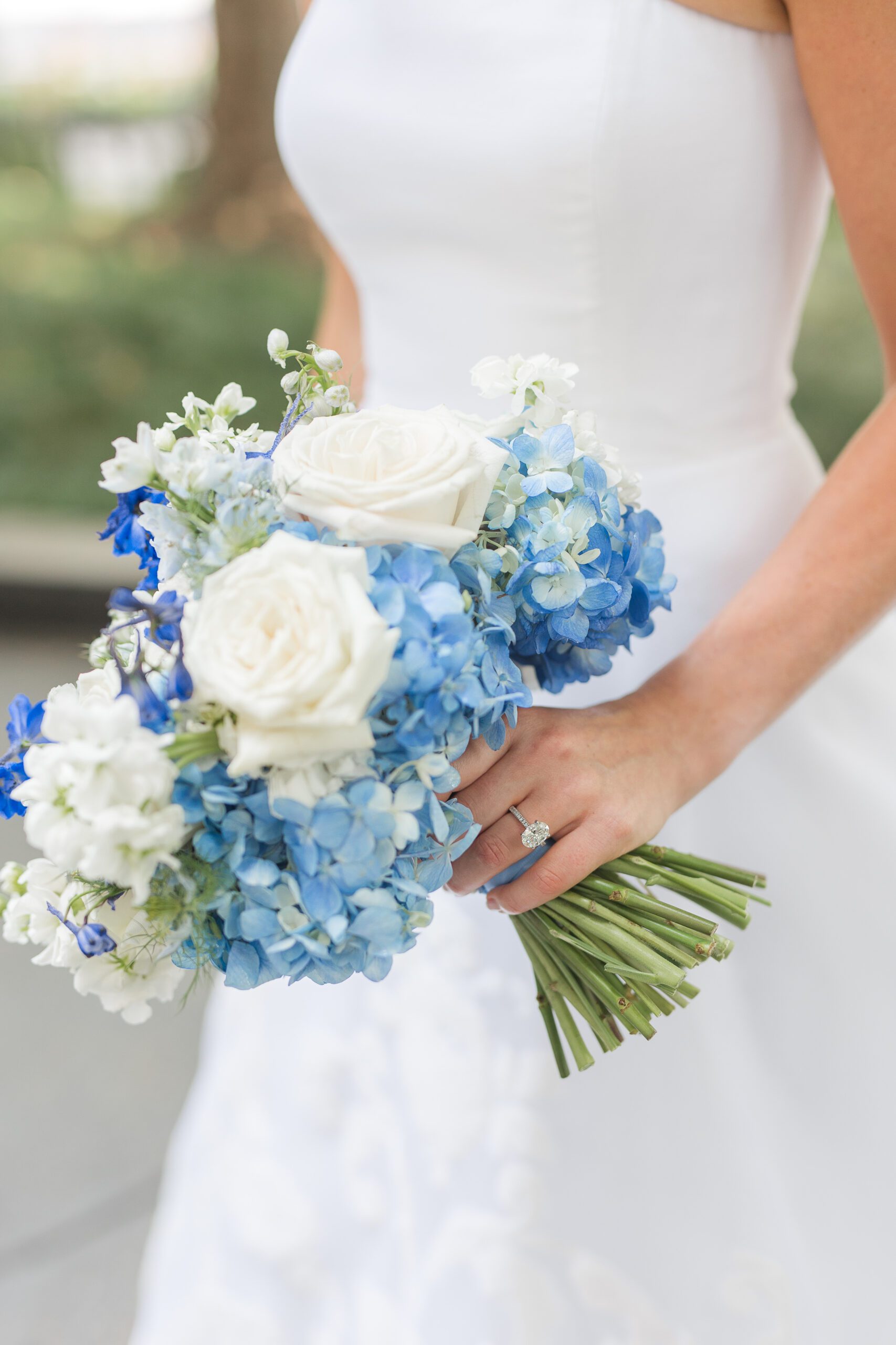 bridal bouquet with roses, delphinium and hydrangeas
