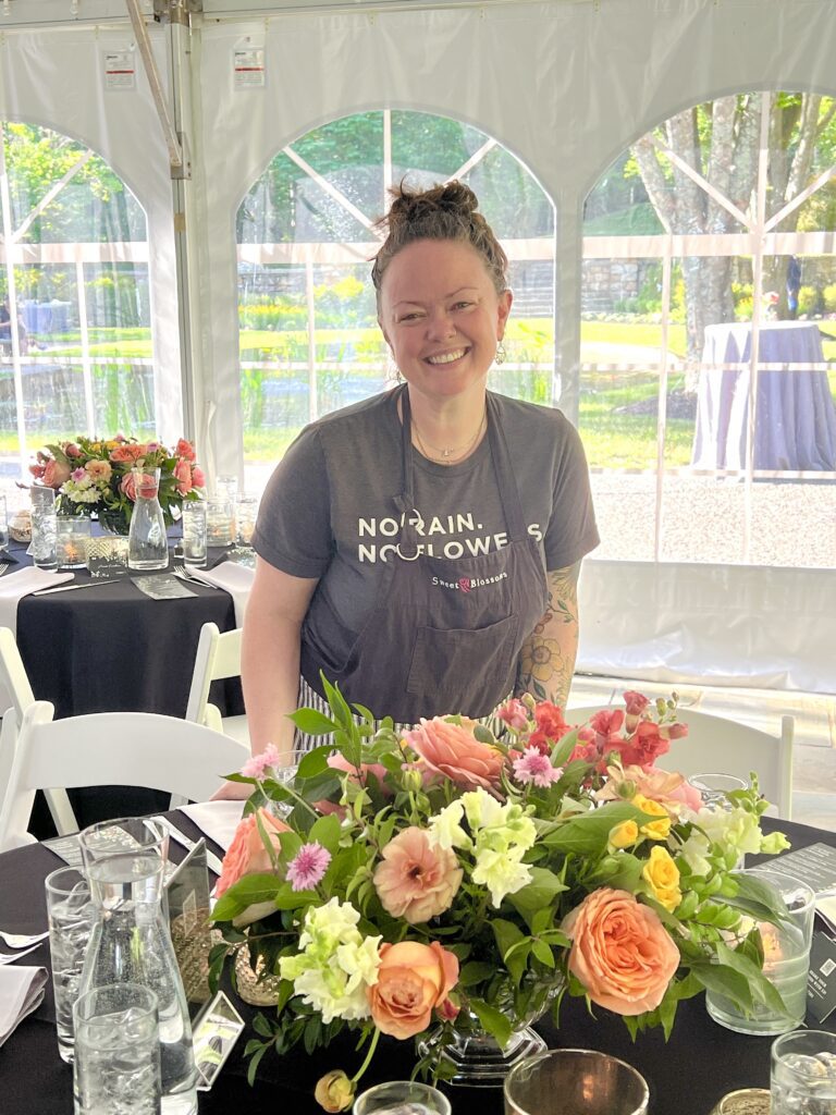 Owner of Sweet Collections and Sweet Blossoms setting up wedding flowers